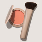 blush compact in peach shade with brush