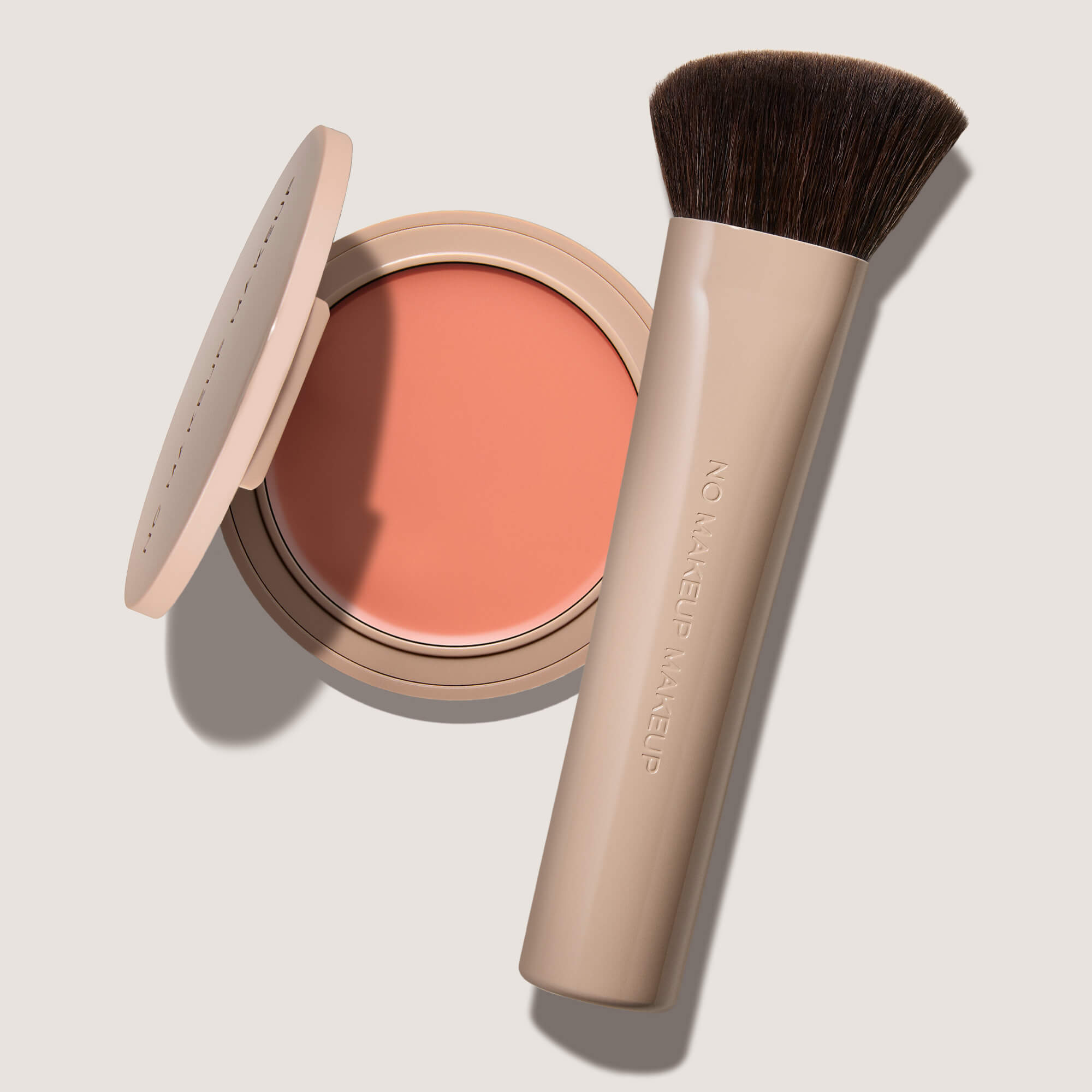 blush compact in peach shade with brush
