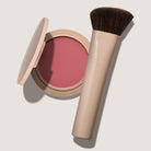 blush compact in pink shade with brush