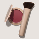 blush compact in plum shade with brush
