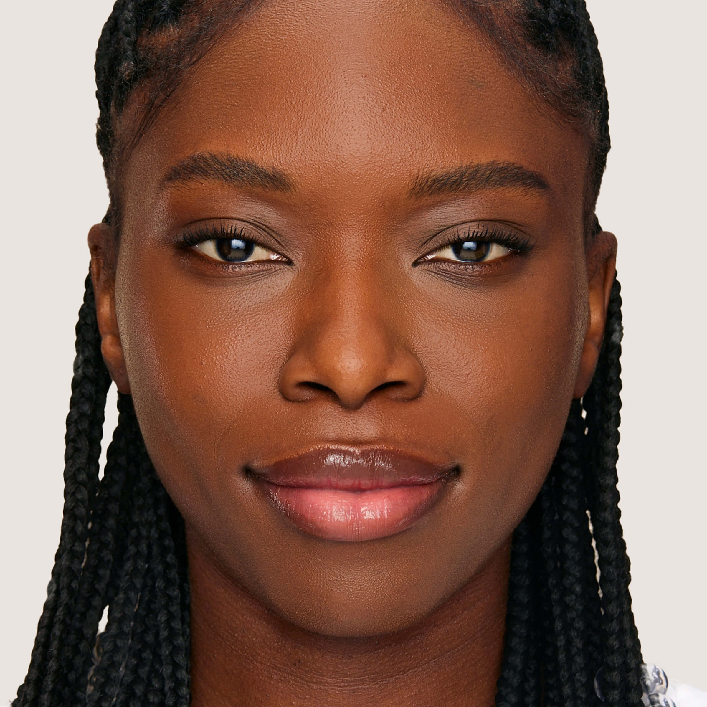 An image of a woman wearing FlexShade Foundation by No Makeup Makeup in Dark