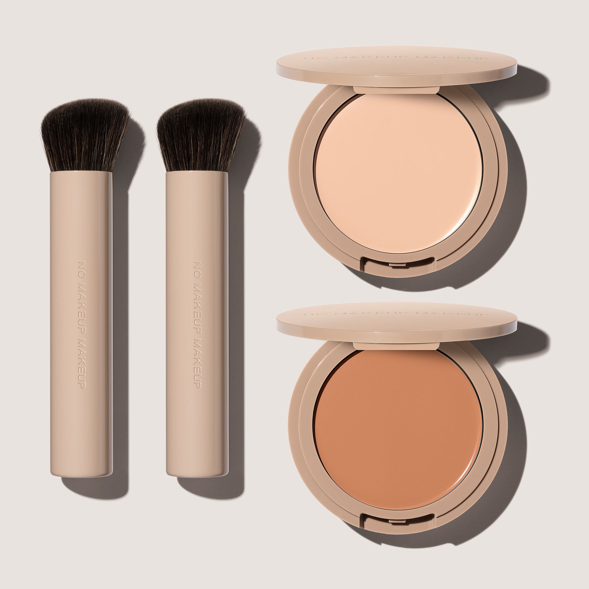 Two FlexShade Foundation by No Makeup Makeups and brushes and an Oprah Daily awards seal