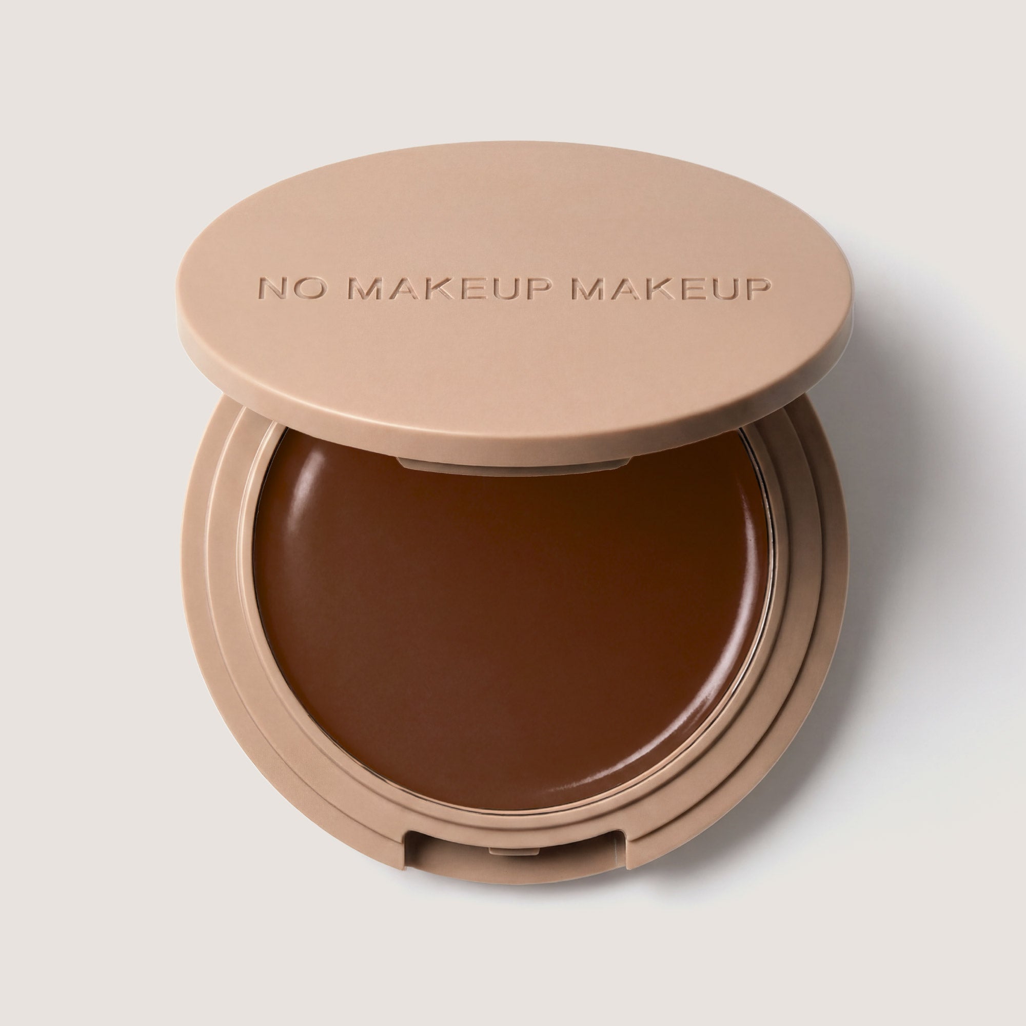 An open FlexShade Foundation by No Makeup Makeup compact in Deep with the Oprah Daily Beauty O-Wards 2024 seal