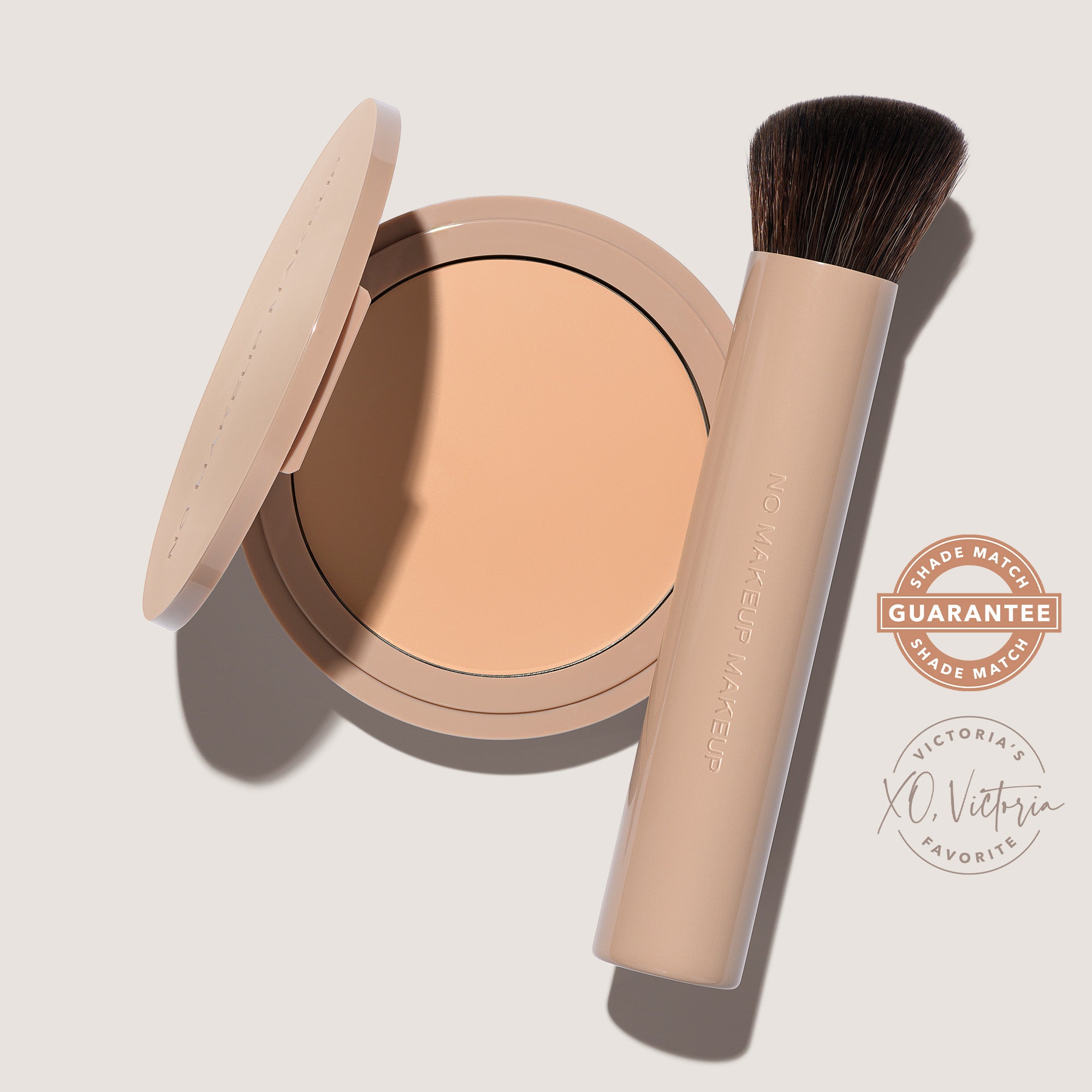 An open FlexShade Foundation by No Makeup Makeup compact in Fair and a brush