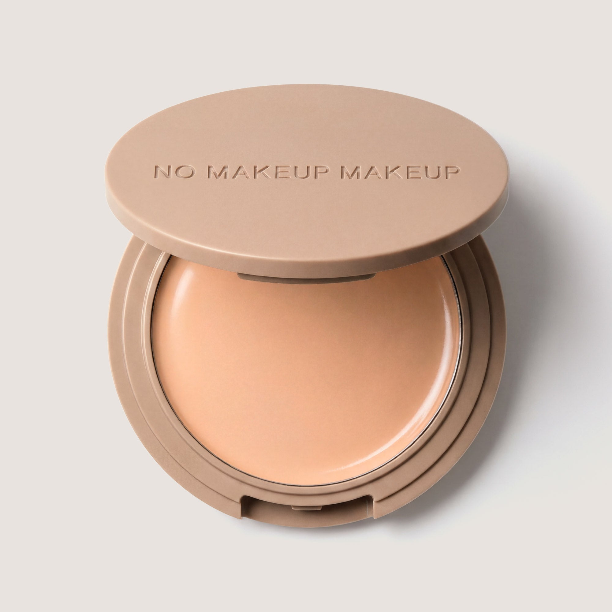 An open FlexShade Foundation by No Makeup Makeup compact in Fair