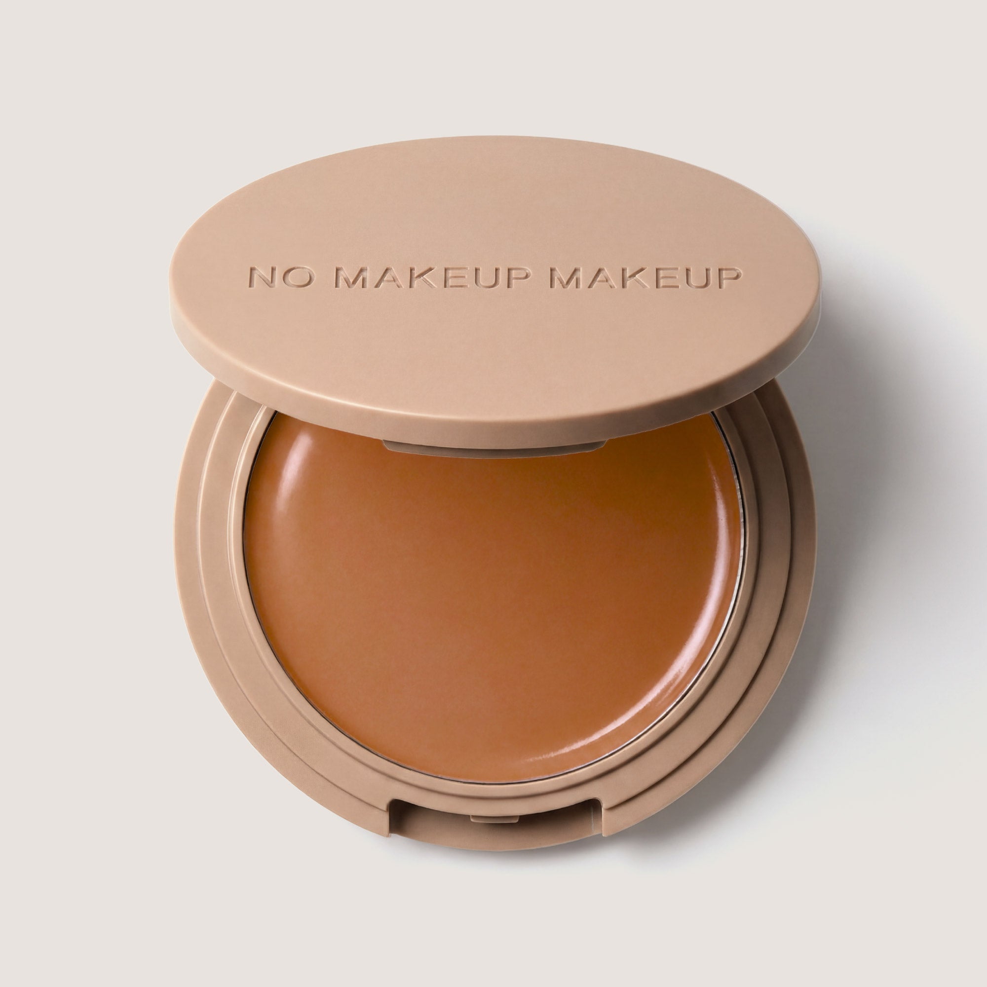 An open FlexShade Foundation by No Makeup Makeup compact in Golden Tan with the Oprah Daily Beauty O-Wards 2024 seal