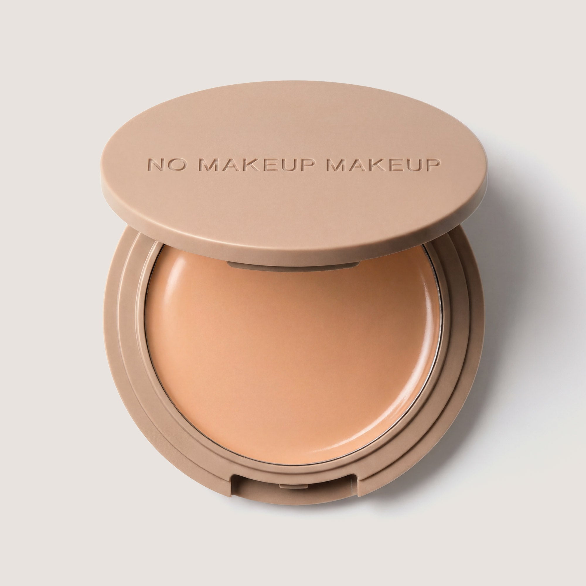 An open FlexShade Foundation by No Makeup Makeup compact in Light