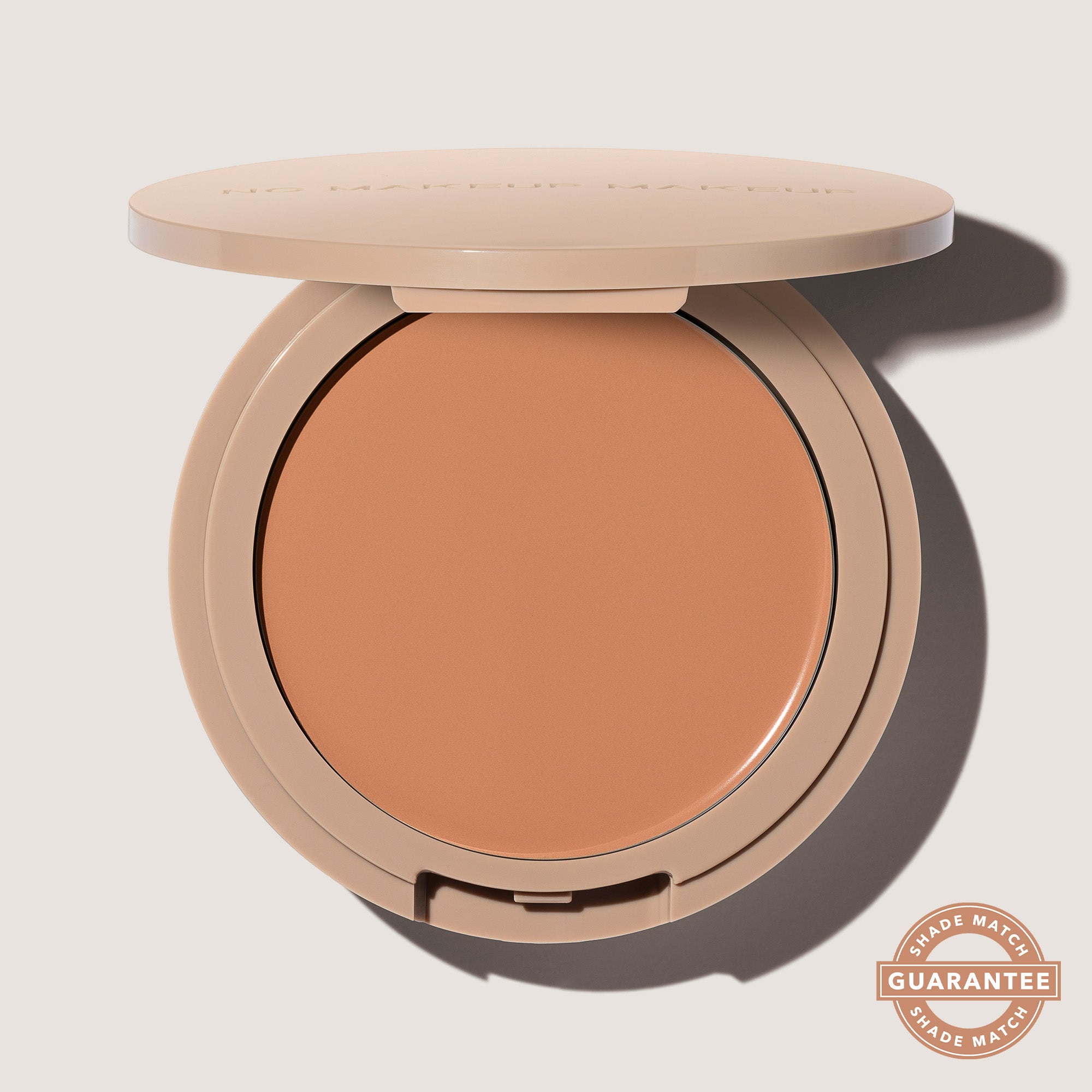 An open FlexShade Foundation by No Makeup Makeup compact in Medium with the Oprah Daily Beauty O-Wards 2024 seal