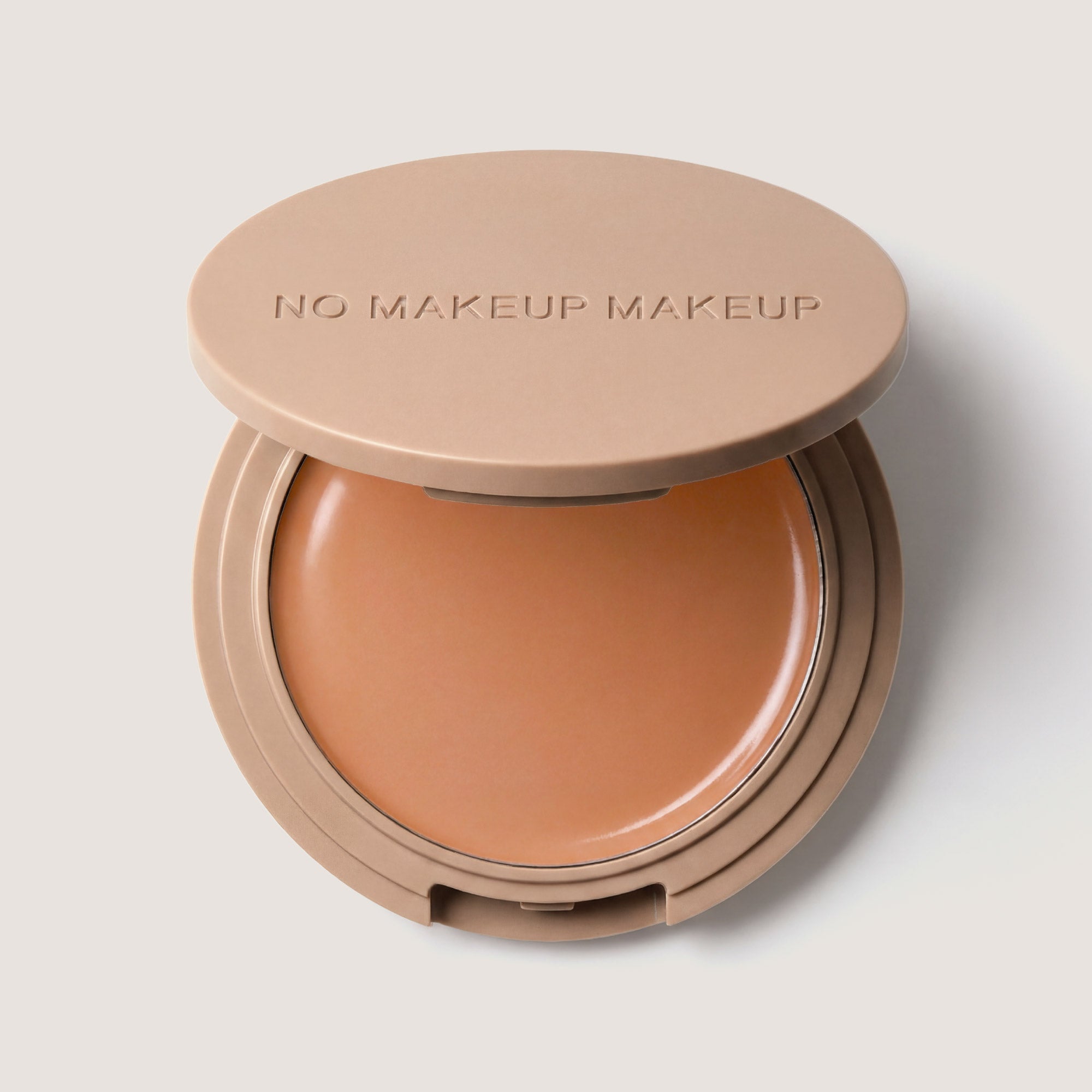 An open FlexShade Foundation by No Makeup Makeup compact in Medium with the Oprah Daily Beauty O-Wards 2024 seal
