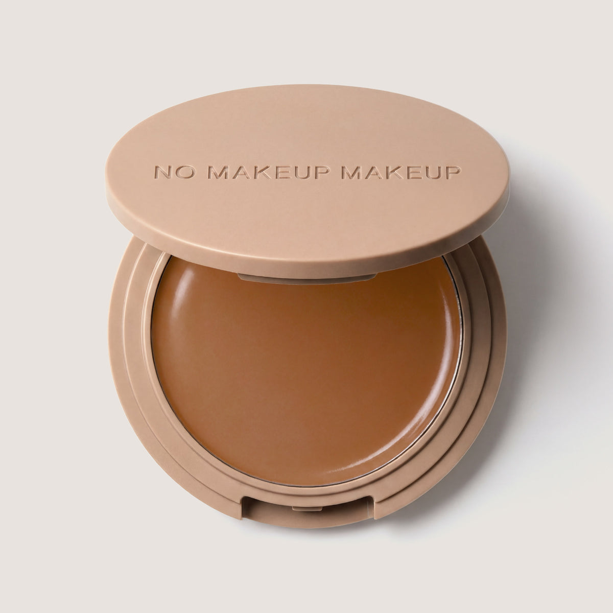An open FlexShade Foundation by No Makeup Makeup compact in Mocha with the Oprah Daily Beauty O-Wards 2024 seal