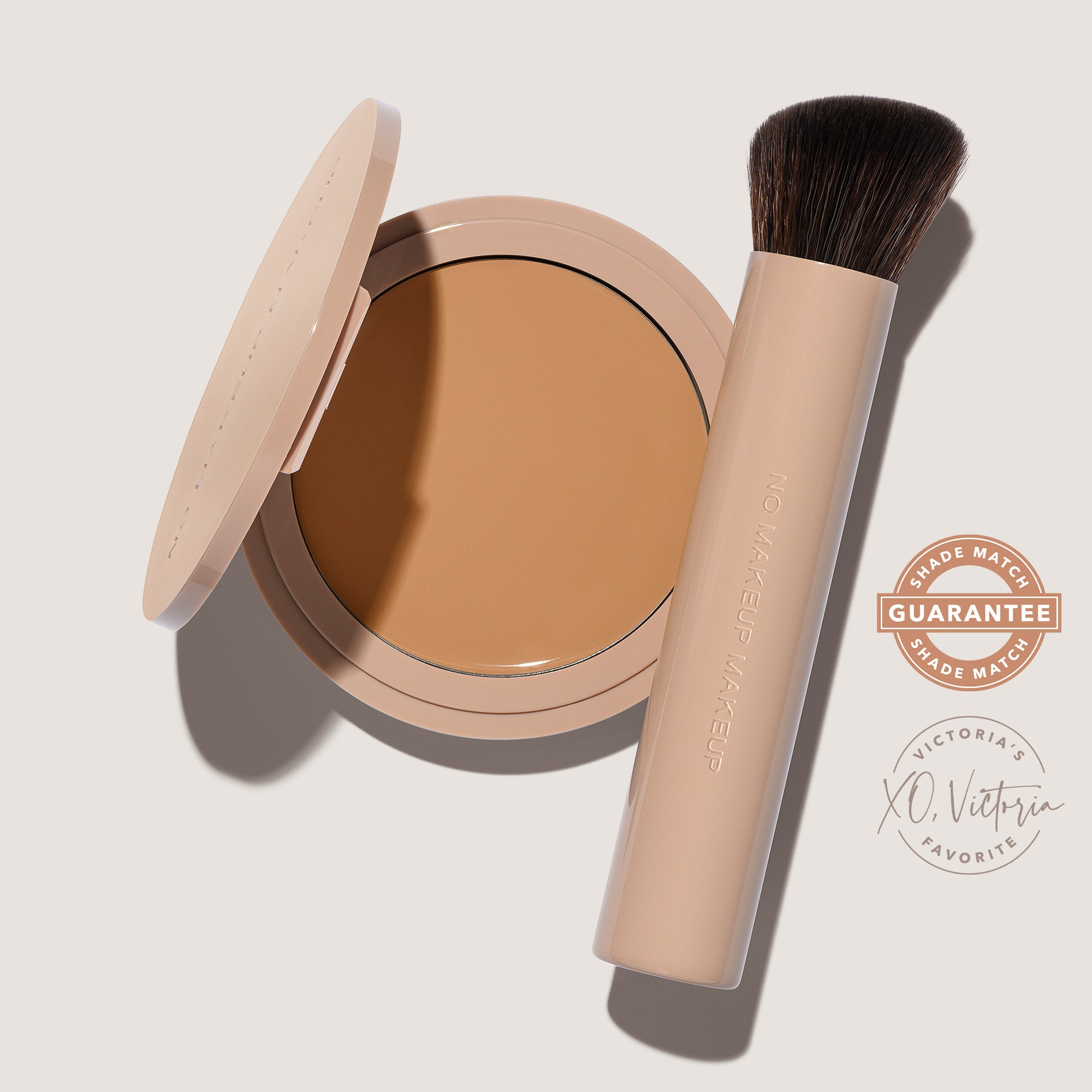 An open FlexShade Foundation by No Makeup Makeup compact in Natural and a brush with the Oprah Daily Beauty O-Wards 2024 seal