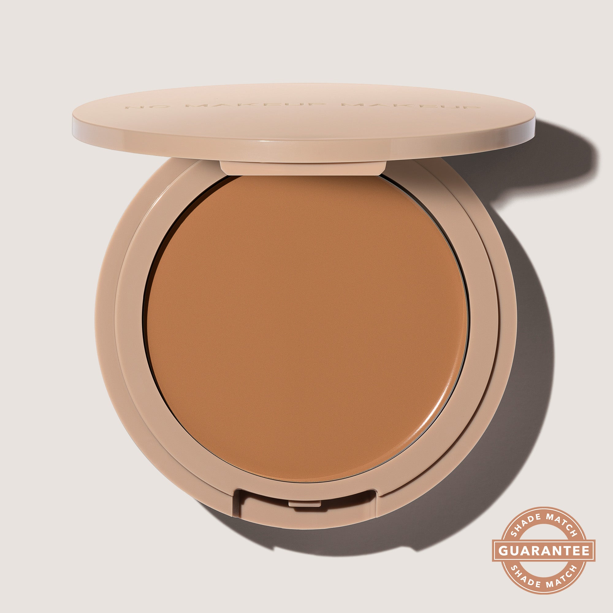 An open FlexShade Foundation by No Makeup Makeup compact in Tan with the Oprah Daily Beauty O-Wards 2024 seal