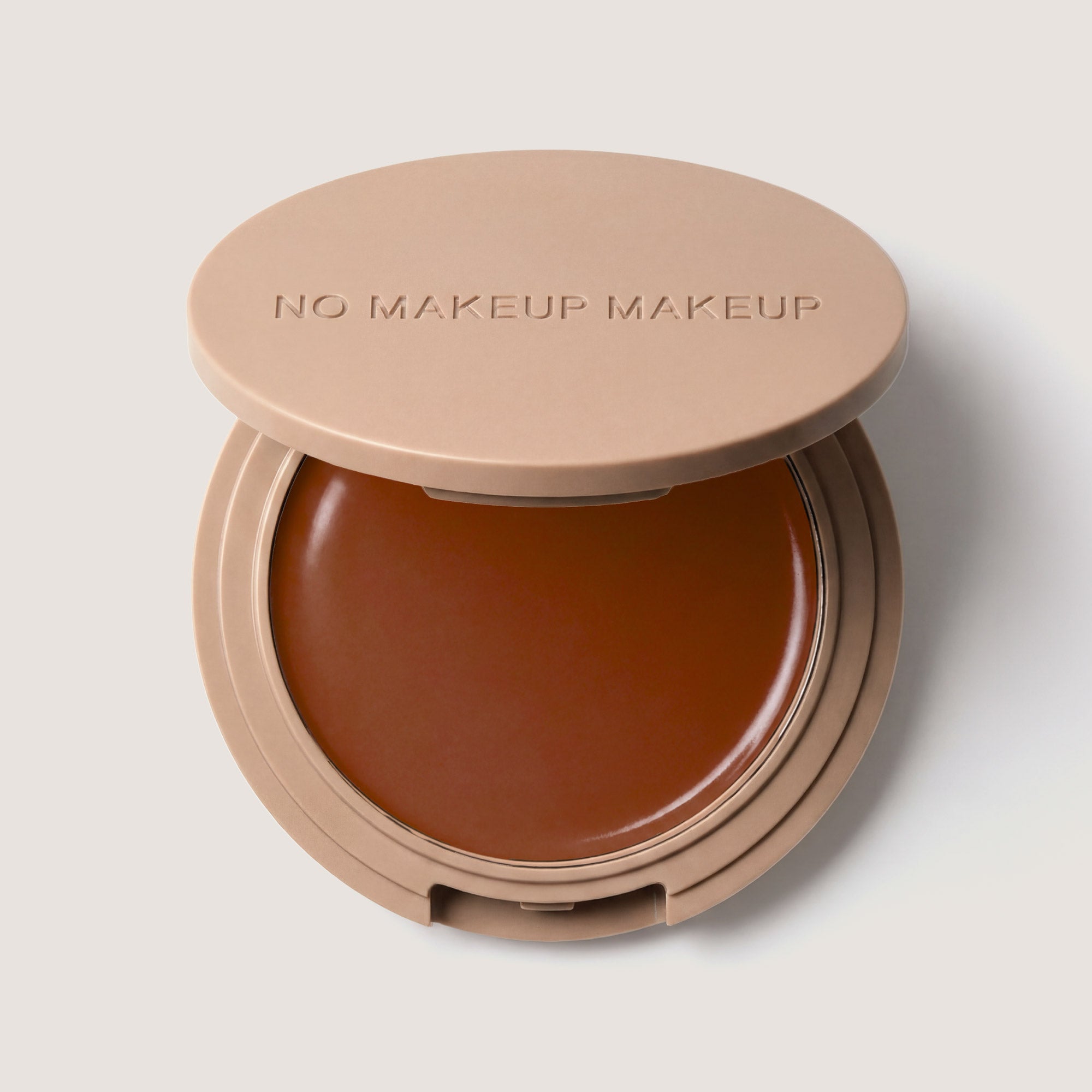 An open FlexShade Foundation by No Makeup Makeup compact in Warm Deep with the Oprah Daily Beauty O-Wards 2024 seal