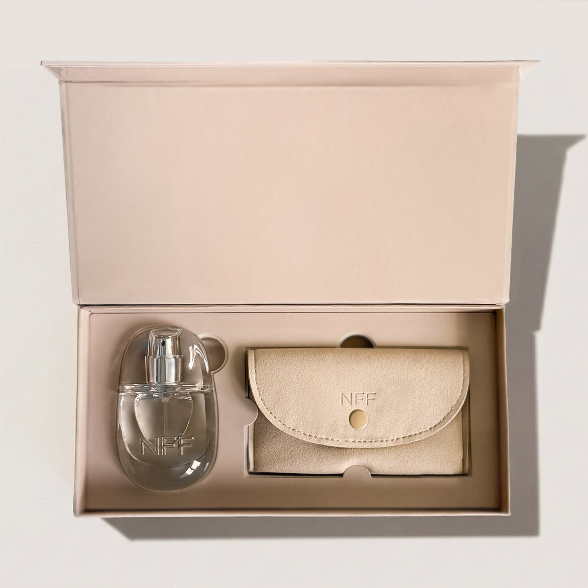 No Fragrance Fragrance bottle and pouch in a beige box on a light background