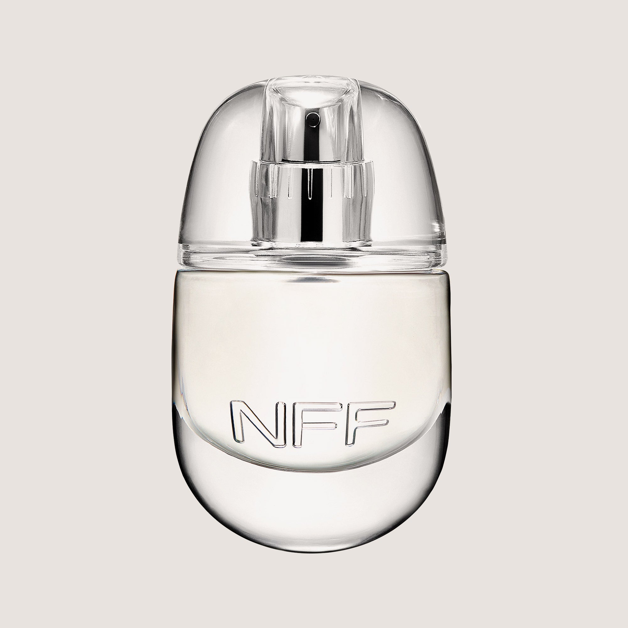 Clear perfume bottle with NFF on a light gray background