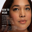 Close-up of a woman's face with makeup application instructions on cheeks and lips.