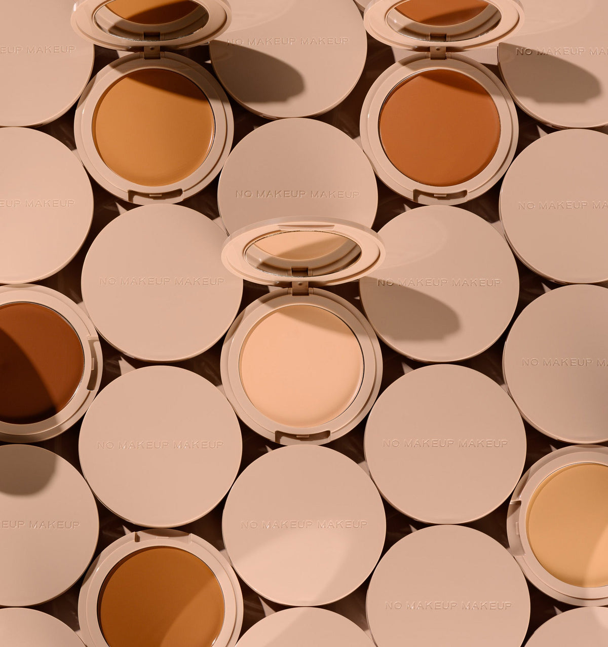 Different skin tone shades of No Makeup Makeup® Foundation compacts