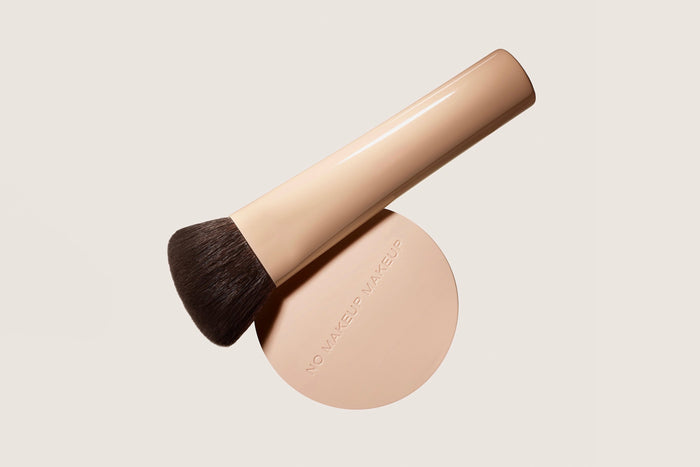 No Makeup Makeup Foundation Compact and The Perfect Foundation Brush on a flat surface