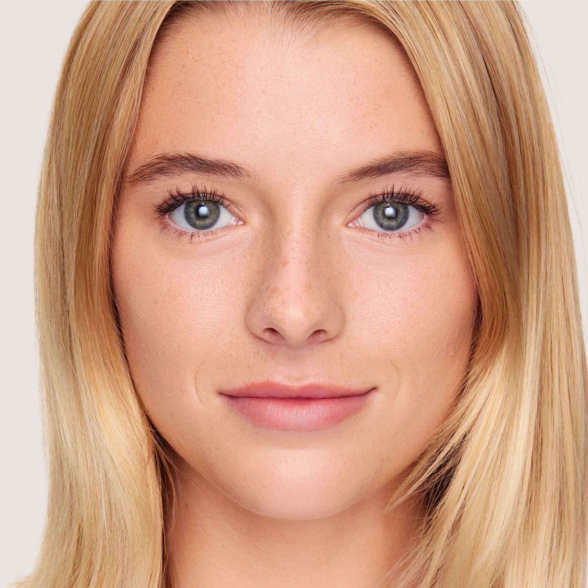 An image of a woman wearing FlexShade Foundation by No Makeup Makeup in Fair