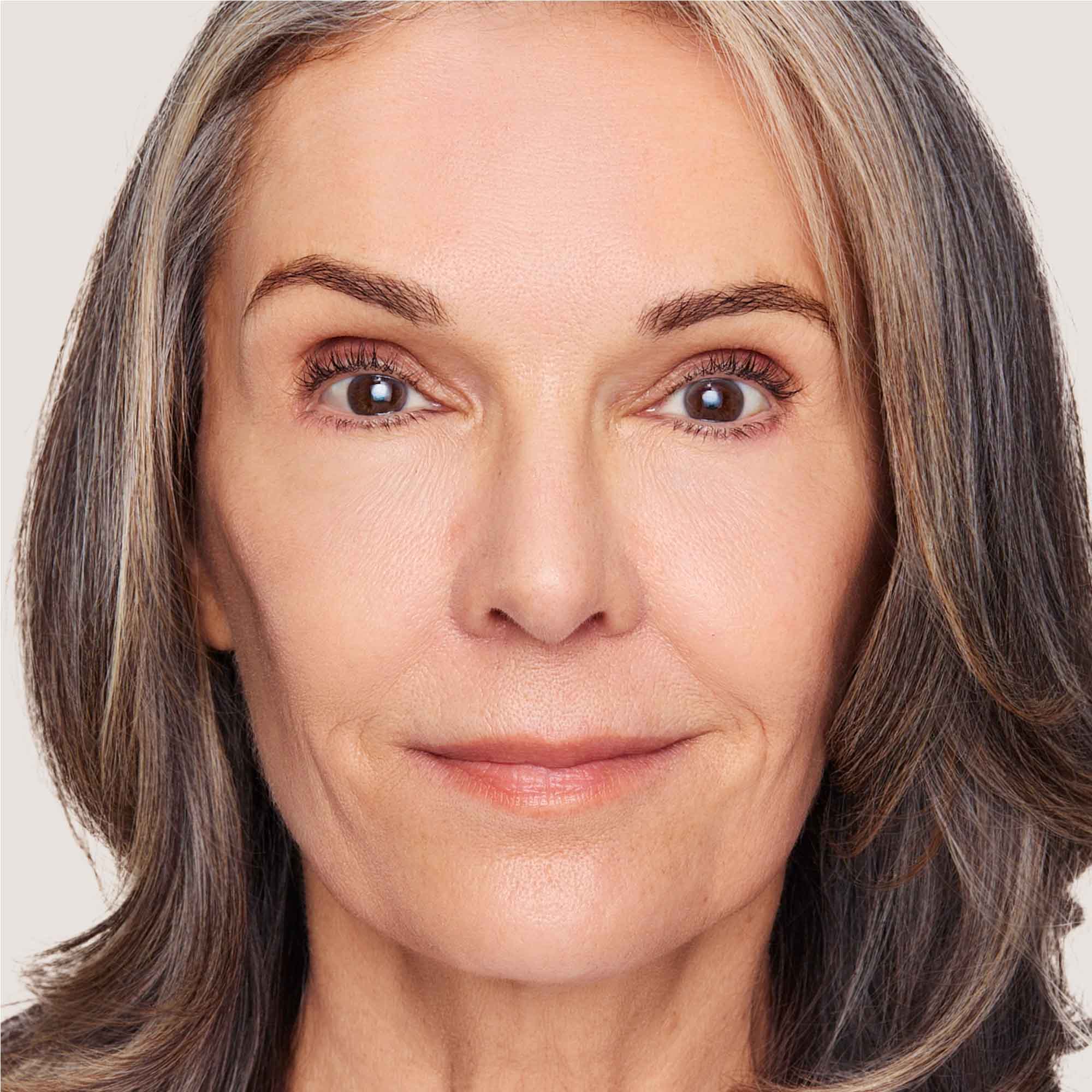 An image of a woman wearing FlexShade Foundation by No Makeup Makeup in Fair
