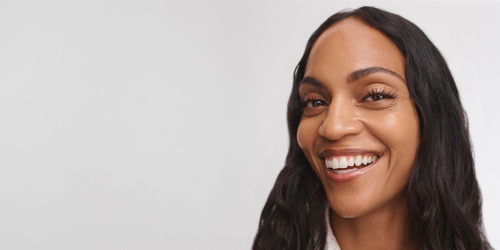 Woman smiling wearing No Makeup Makeup Perfect Swipe Mascara
