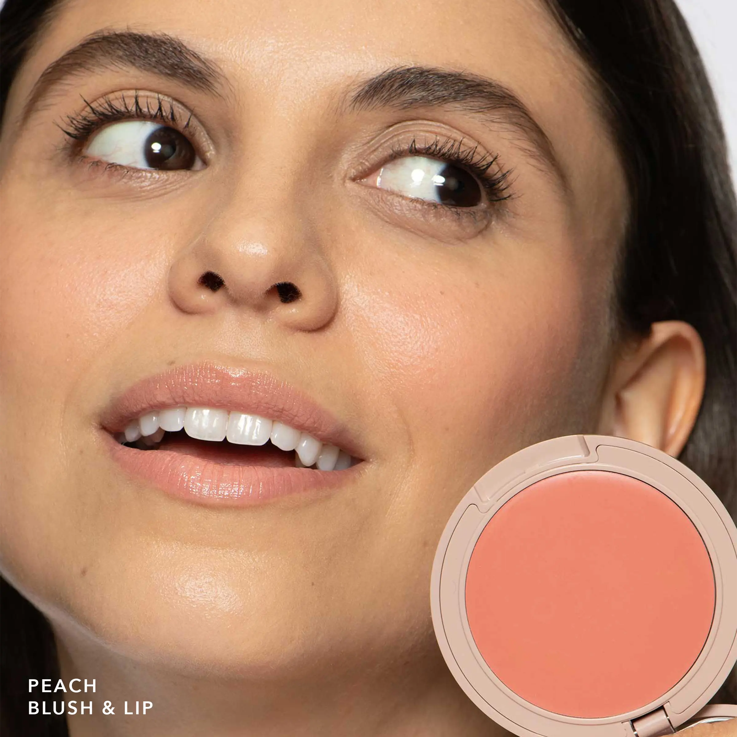 No Makeup Makeup – Close-up of a woman's face with a compact peach blush palette next to her, natural minimal makeup