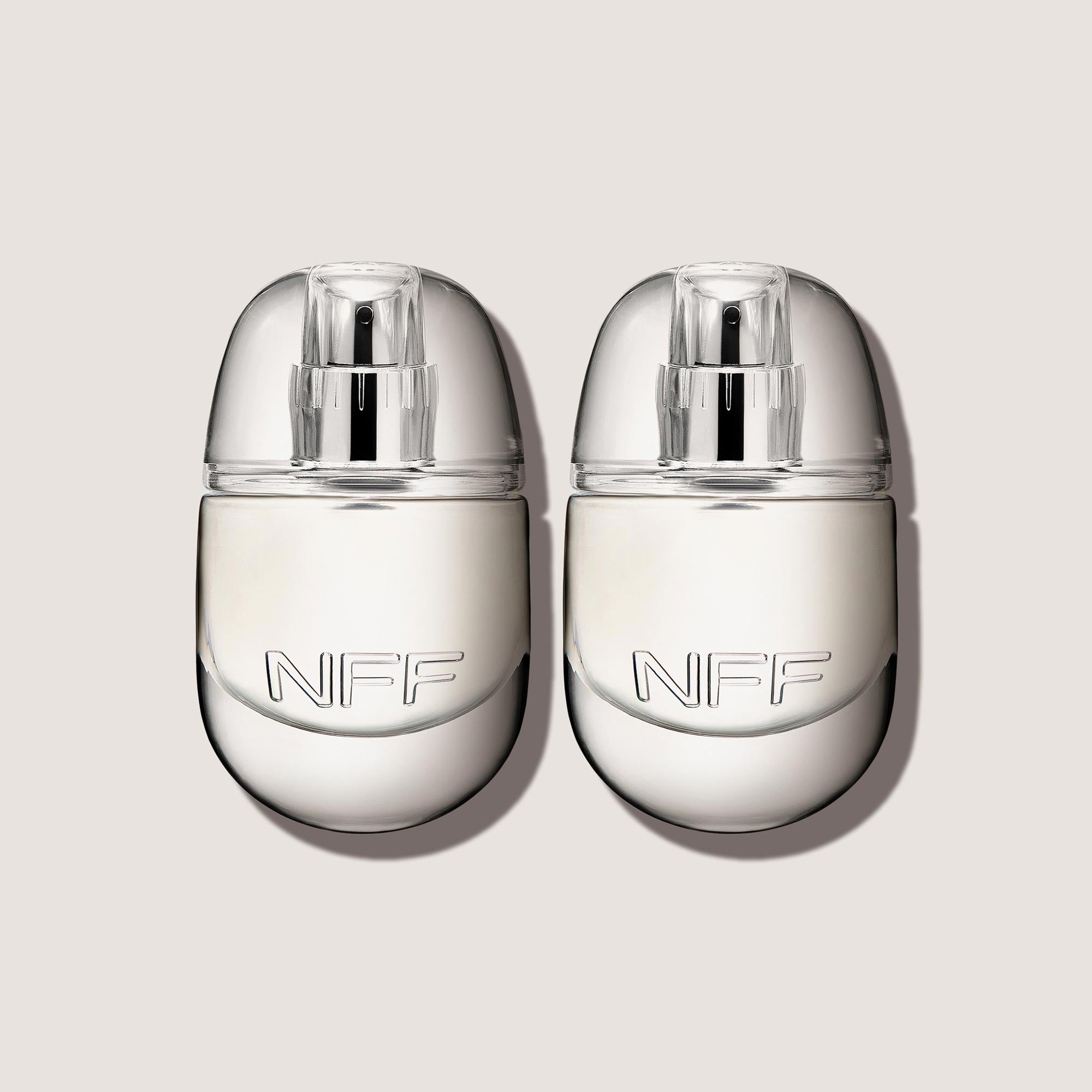 Two No Fragrance Fragrance perfume bottles on a light background