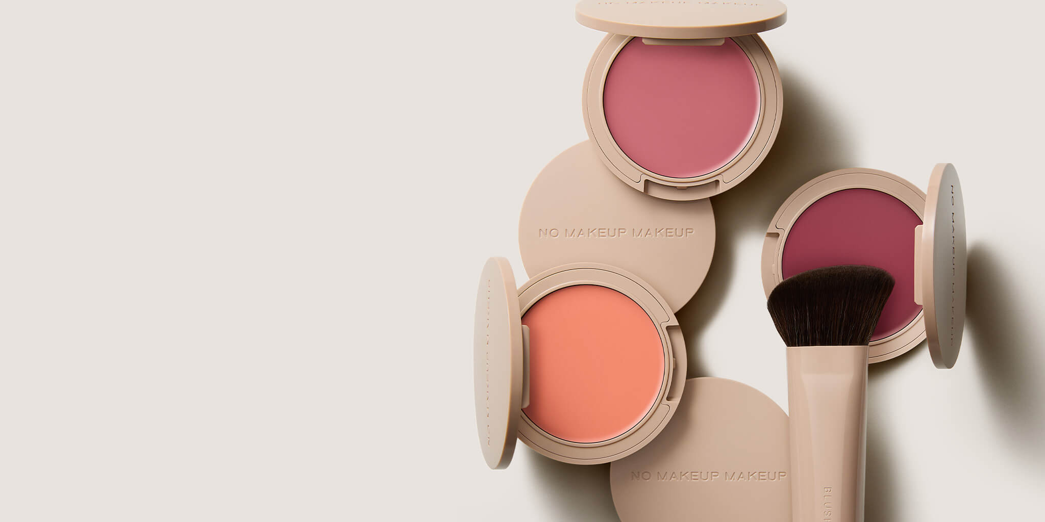 blush compacts and a brush