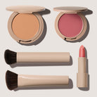 No Makeup Makeup – Makeup set with Foundation, blush & lip color, Creme Classic Lipstick, the perfect foundation brush, and blush brush on a light background, natural minimal makeup