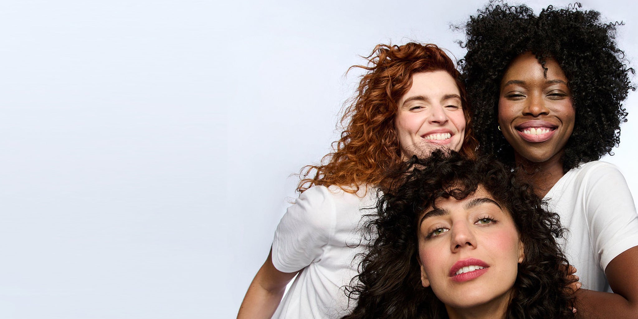 Three Women Smiling Wearing No Makeup Makeup Foundation, Blush, and Classic Creme Lipstick