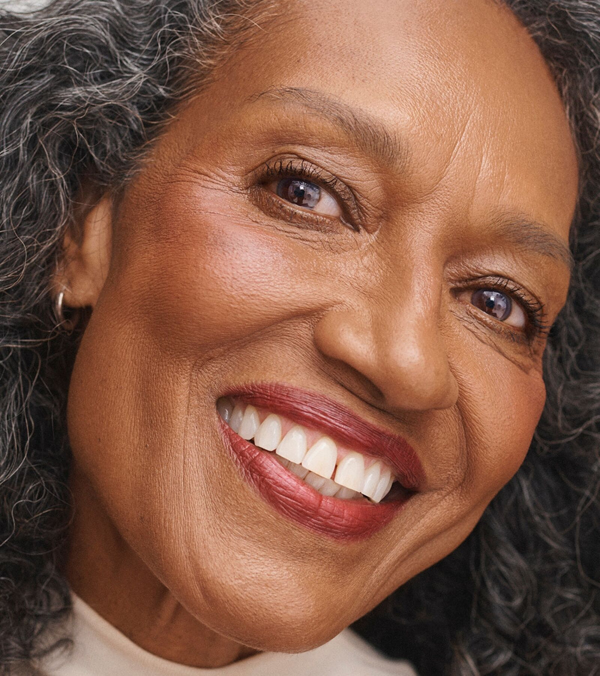 Pat Mature darker skin woman wearing No Makeup Makeup Perfect Swipe Mascara in black